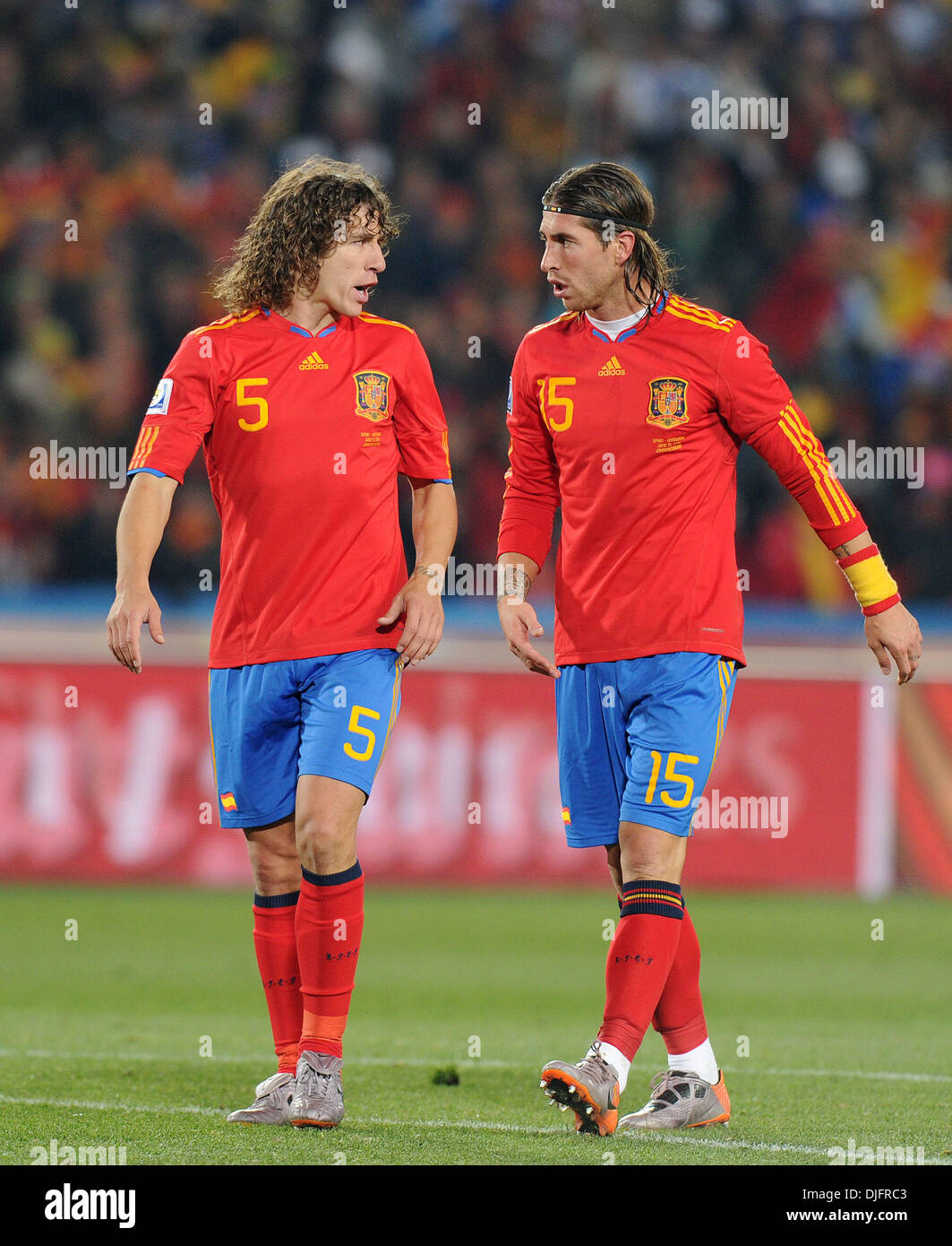 June 22, 2010 - Carles Puyol of Spain speaks with Sergio Ramos during the 2010 FIFA World Cup soccer match between Spain and Honduras at Ellis Park Stadium on June 21, 2010 in Johannesburg, South Africa. (Credit Image: © Luca Ghidoni/ZUMApress.com) Stock Photo