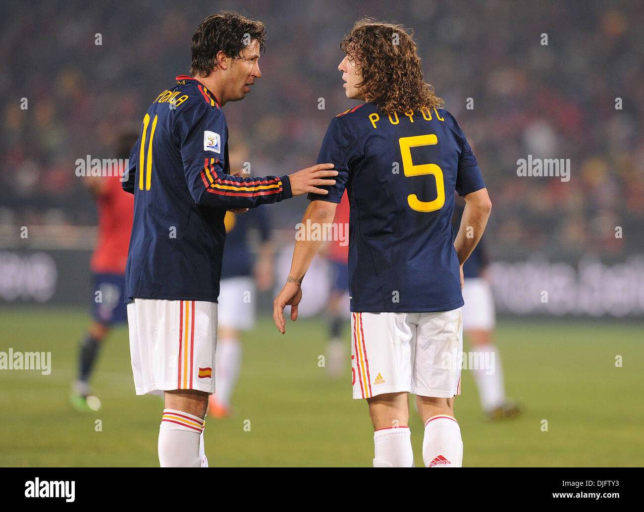 June 25, 2010 - Pretoria, South Africa - Joan Capdevila of Spain speaks with Carles Puyol during the 2010 FIFA World Cup soccer match between Chile and Spain at Loftus Versfeld Stadium on June 25, 2010 in Pretoria, South Africa. (Credit Image: © Luca Ghidoni/ZUMApress.com) Stock Photo