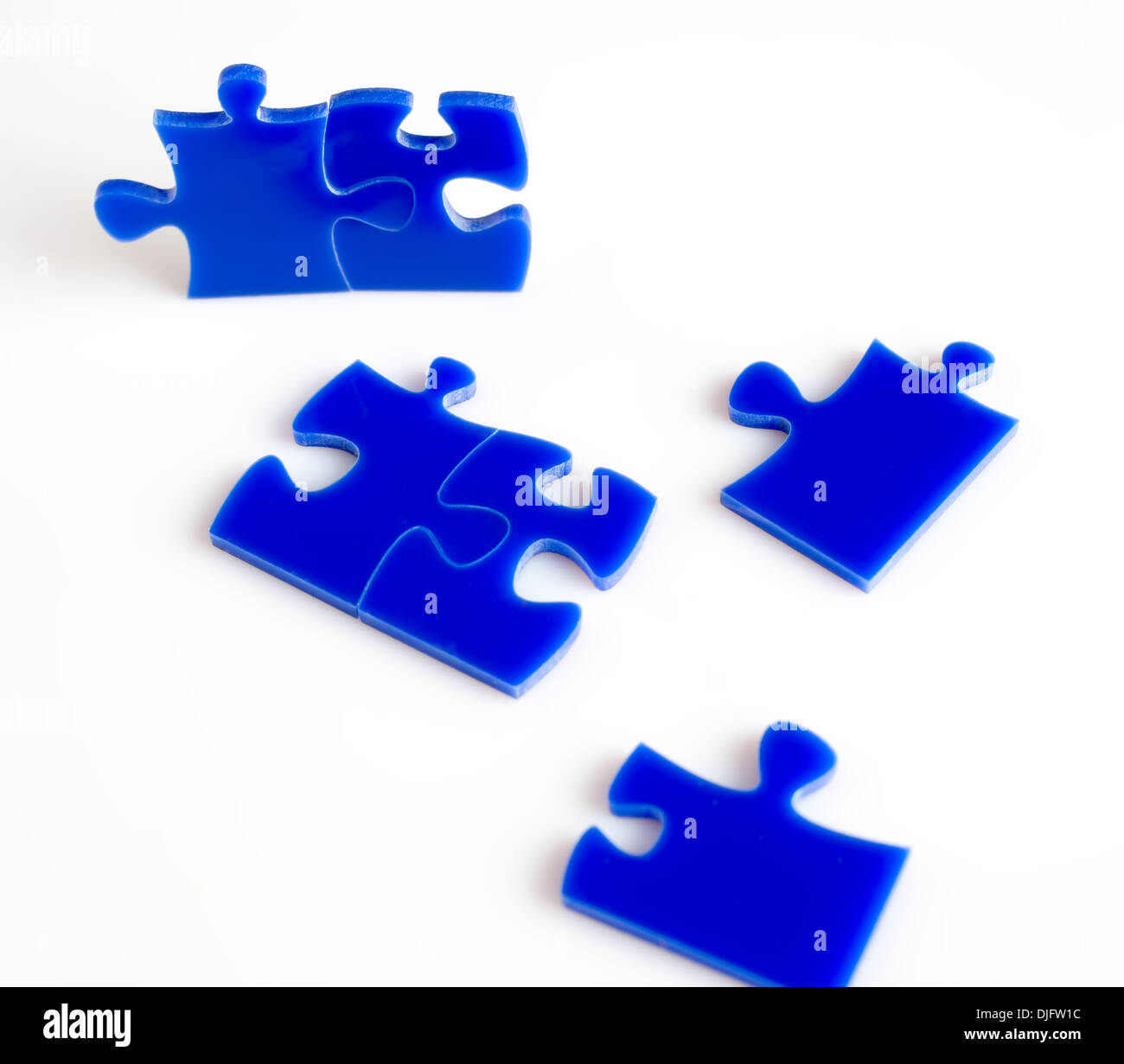 Blue Jigsaw puzzles blocks isolated on a white background. Stock Photo