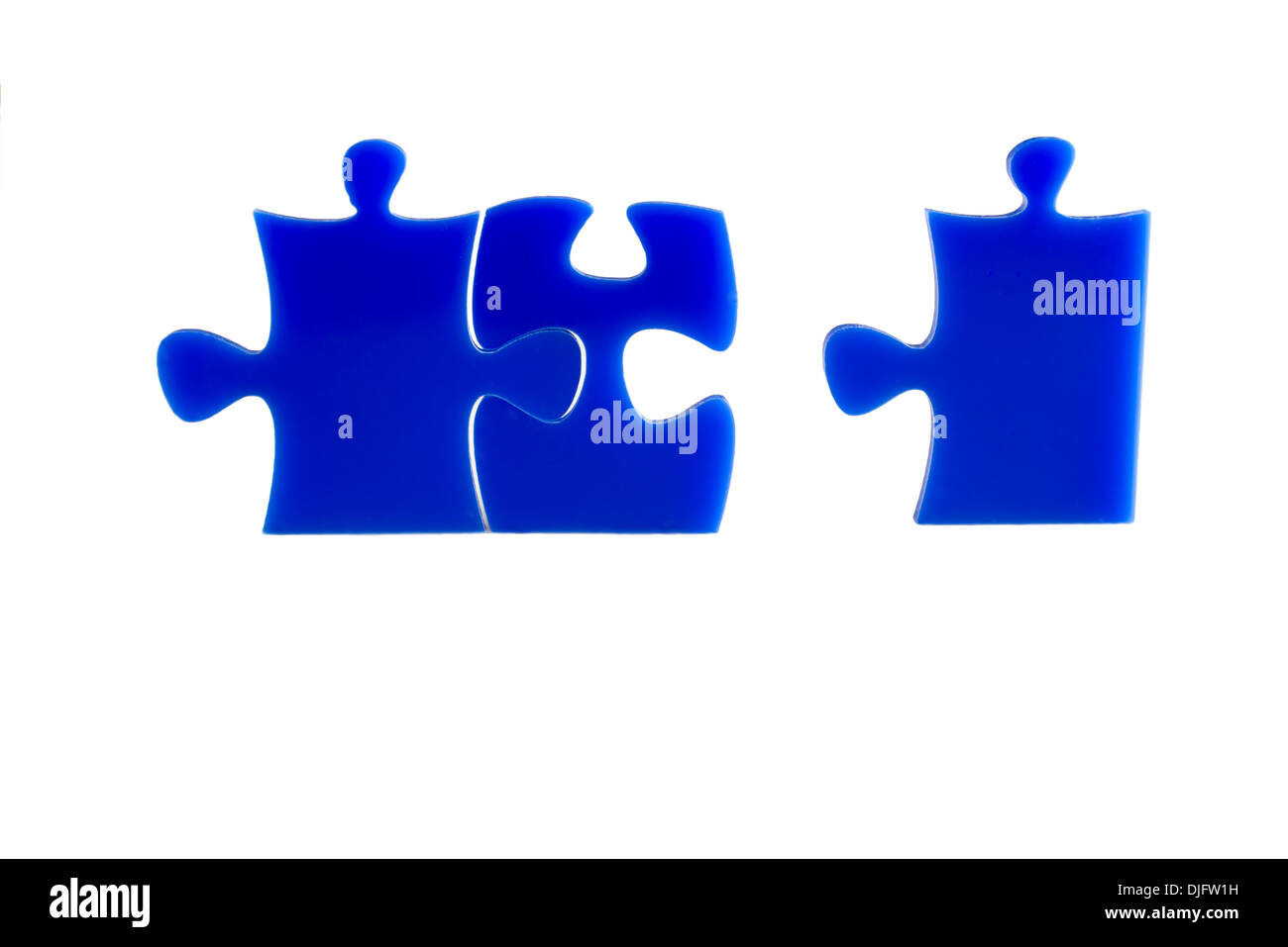 Blue Jigsaw puzzles blocks isolated on a white background. Stock Photo