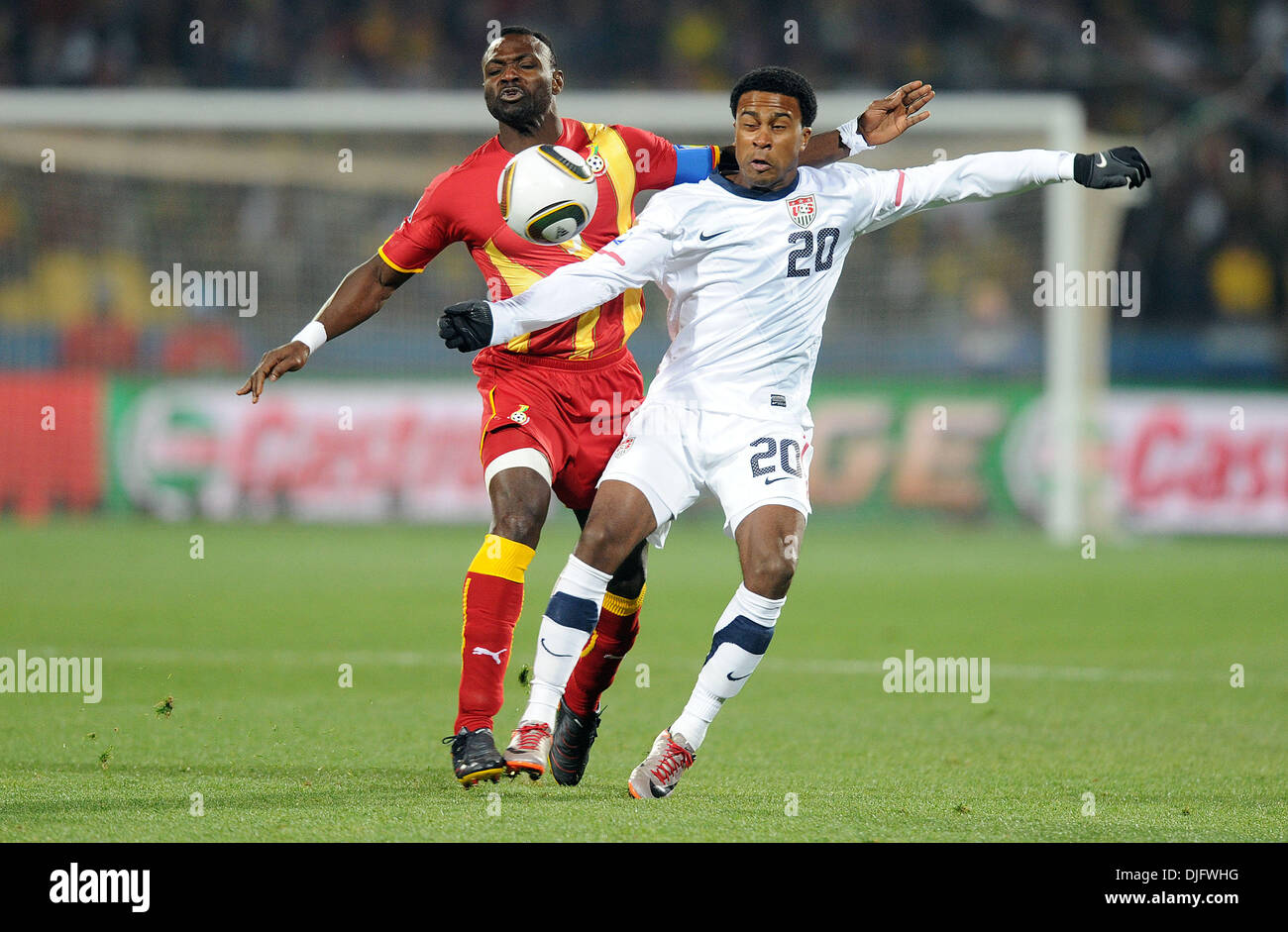 June 26, 2010 - Rustenburg, South Africa - Robbie Findley of USA fights for the ball with John Mensah of Ghana during the 2010 FIFA World Cup soccer match between USA and Ghana at Royal Bafokeng Stadium on June 26, 2010 in Rustenburg, South Africa. (Credit Image: © Luca Ghidoni/ZUMApress.com) Stock Photo