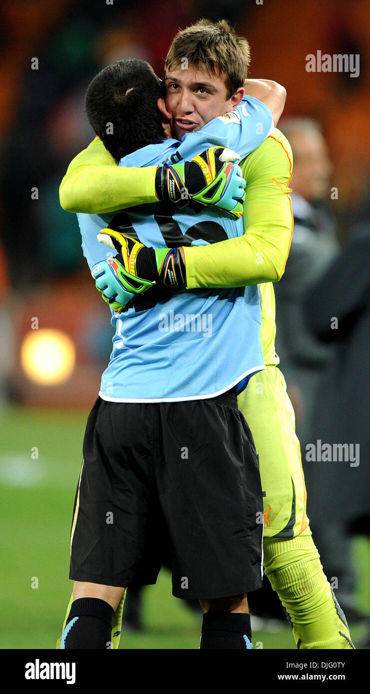 July 02, 2010 - Johannesburg, South Africa - Fernando Muslera of Uruguay celebrates the victory with Maximiliano Pereira during the 2010 FIFA World Cup Quarter Final soccer match between Uruguay and Ghana at Soccer City Stadium on June 02, 2010 in Johannesburg, South Africa. (Credit Image: © Luca Ghidoni/ZUMApress.com) Stock Photo