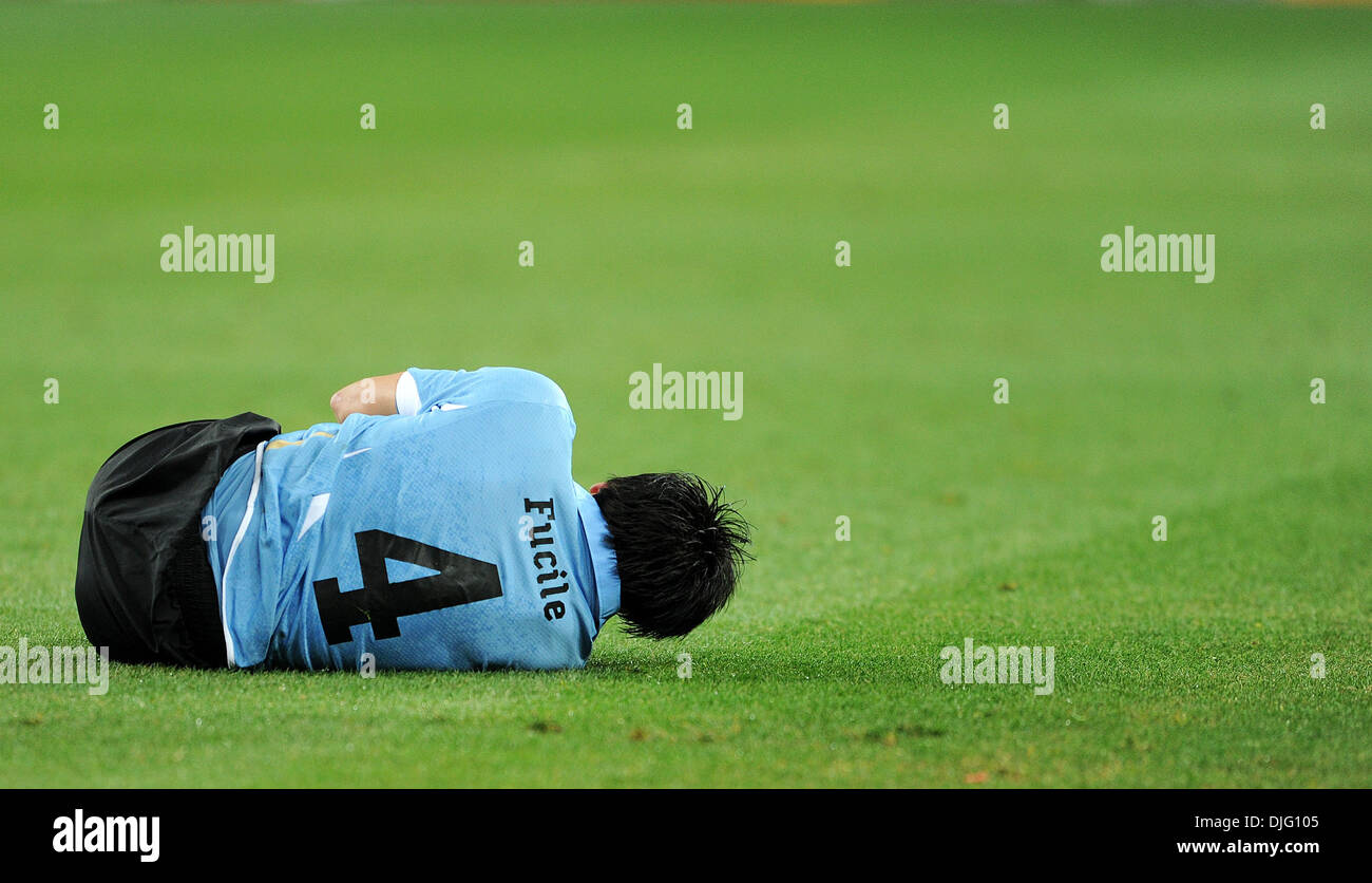 July 02, 2010 - Johannesburg, South Africa - Jorge Fucile of Uruguay falls on the pitch during the 2010 FIFA World Cup Quarter Final soccer match between Uruguay and Ghana at Soccer City Stadium on June 02, 2010 in Johannesburg, South Africa. (Credit Image: © Luca Ghidoni/ZUMApress.com) Stock Photo