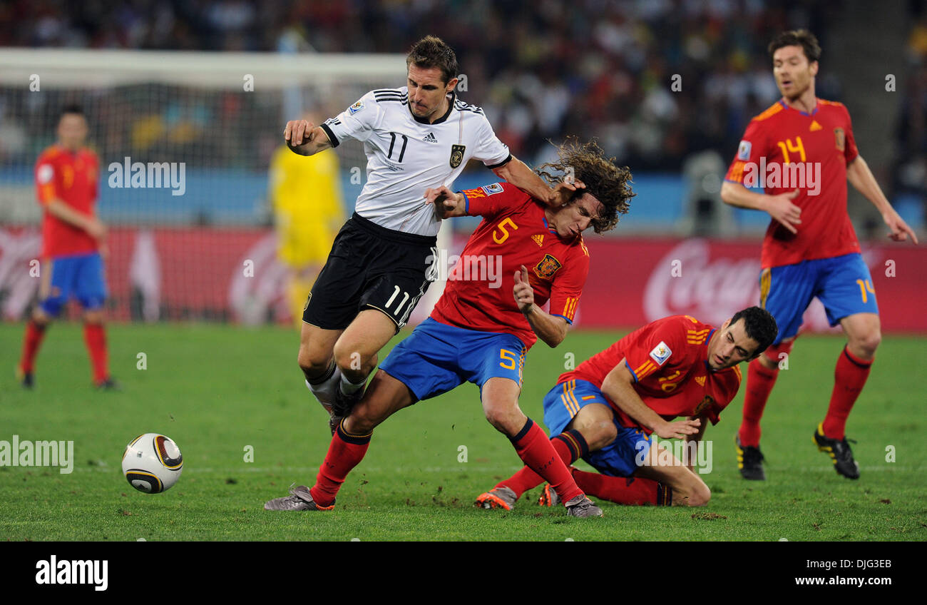 July 07, 2010 - Durban, South Africa - Miroslav Klose of Germany fights for the ball with Carles Puyol of Spain during the 2010 FIFA World Cup Semi Final soccer match between Germany and Spain at Princess Magogo Stadium on July 7, 2010 in Durban, South Africa. (Credit Image: © Luca Ghidoni/ZUMApress.com) Stock Photo