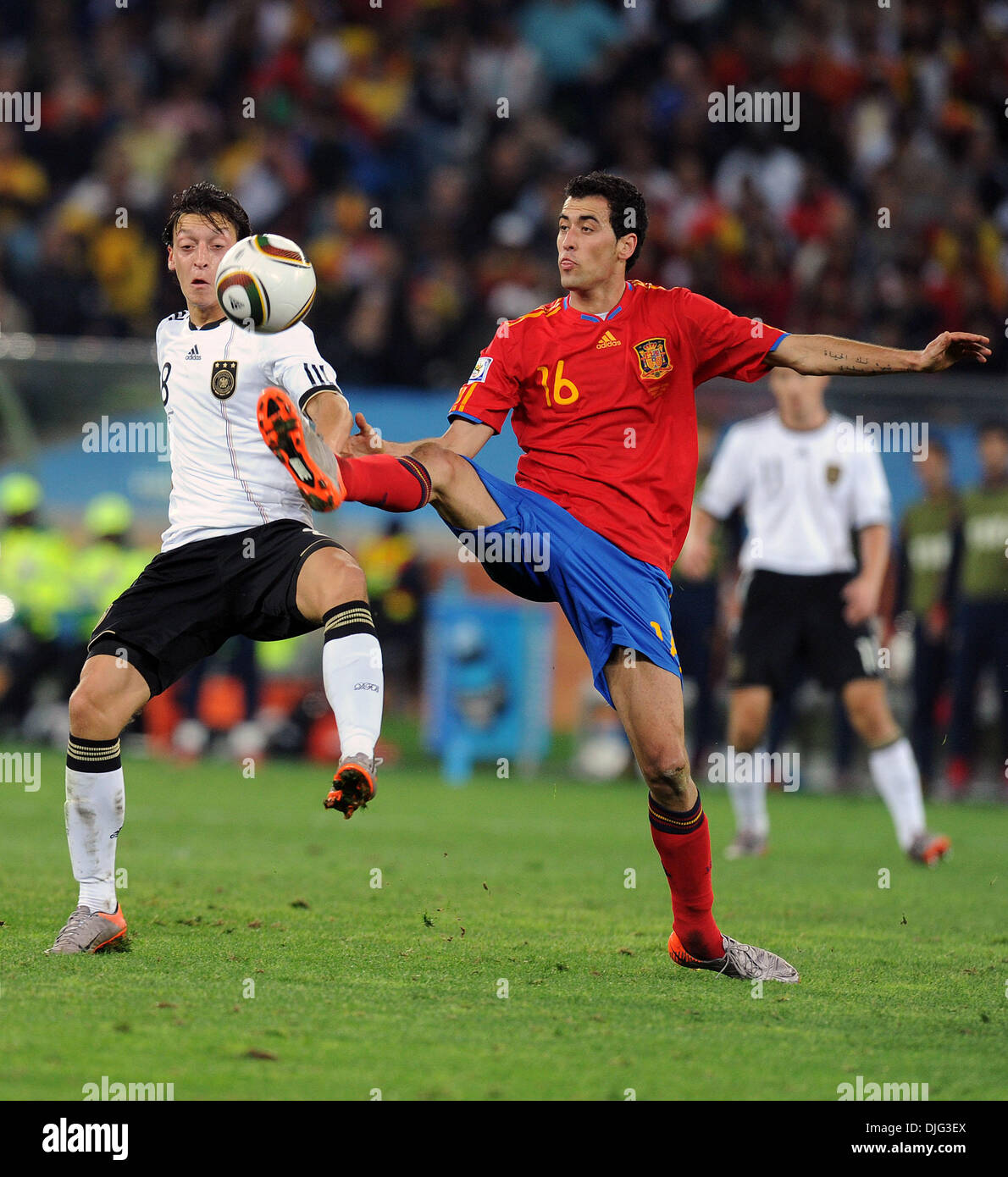 July 07, 2010 - Durban, South Africa - Mesut Oezil of Germany fights for the ball with Sergio Busquets of Spain during the 2010 FIFA World Cup Semi Final soccer match between Germany and Spain at Princess Magogo Stadium on July 7, 2010 in Durban, South Africa. (Credit Image: © Luca Ghidoni/ZUMApress.com) Stock Photo