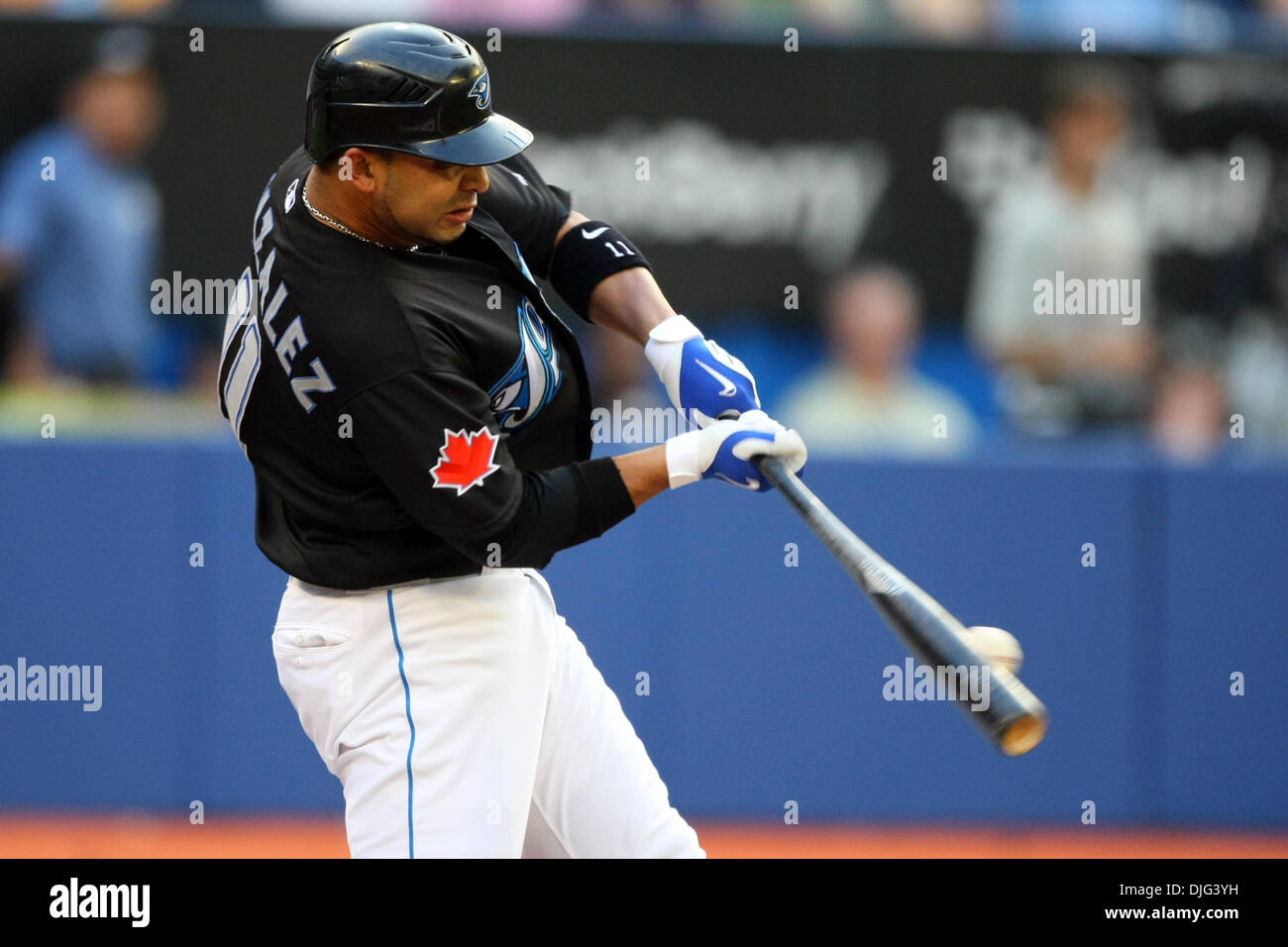 Toronto Blue Jays shortstop Alex Gonzalez (11) make contact with the