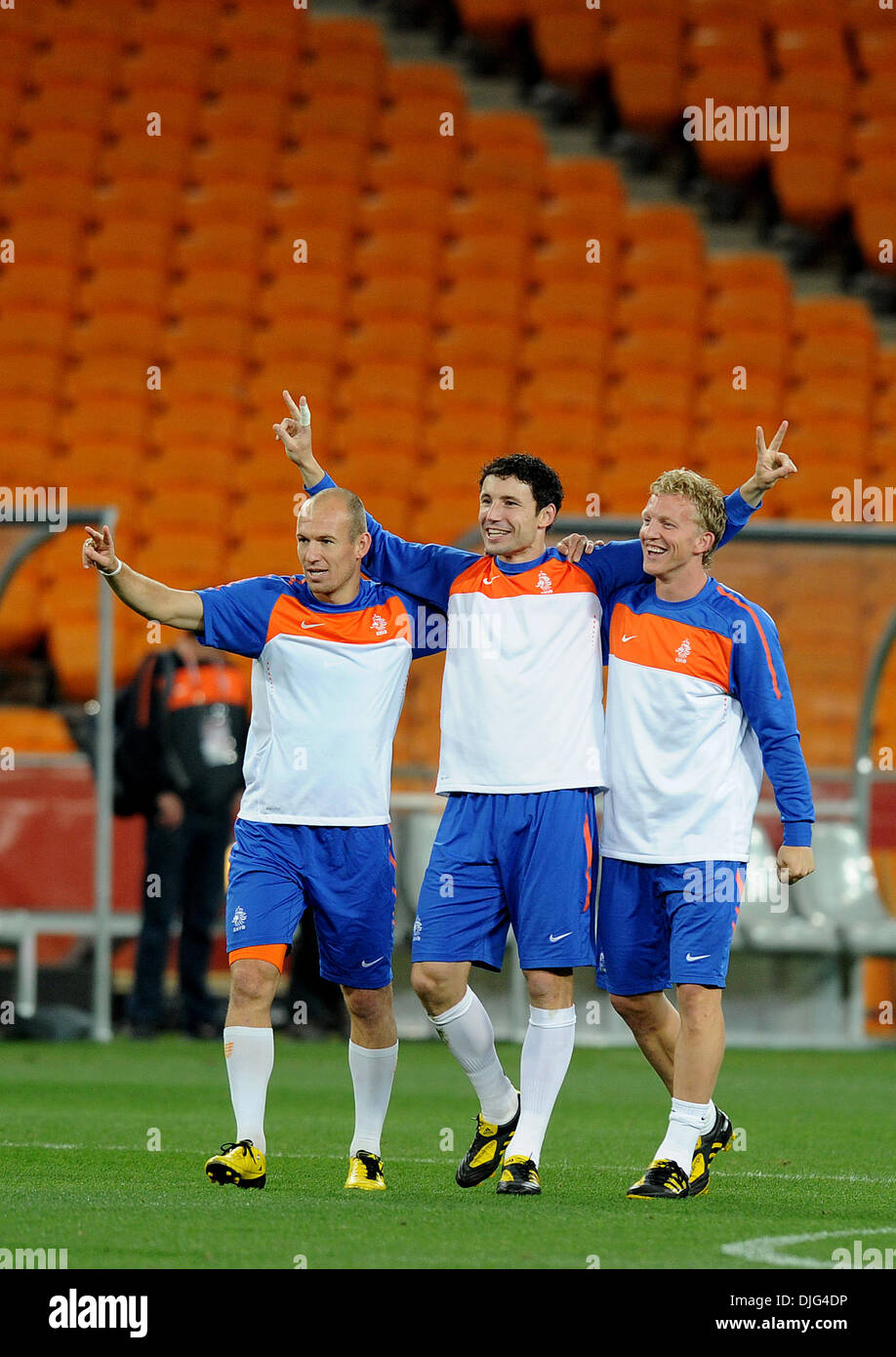 July 10, 2010 - Johannesburg, South Africa - Arjen Robben, Mark Van Bommel and Dirk Kuyt of the Netherlands celebrate during an official training session at Soccer City stadium in Soweto, suburban Johannesburg, on July 10, 2010 a day before they meet Spain in the 2010 World Cup football final. (Credit Image: © Luca Ghidoni/ZUMApress.com) Stock Photo