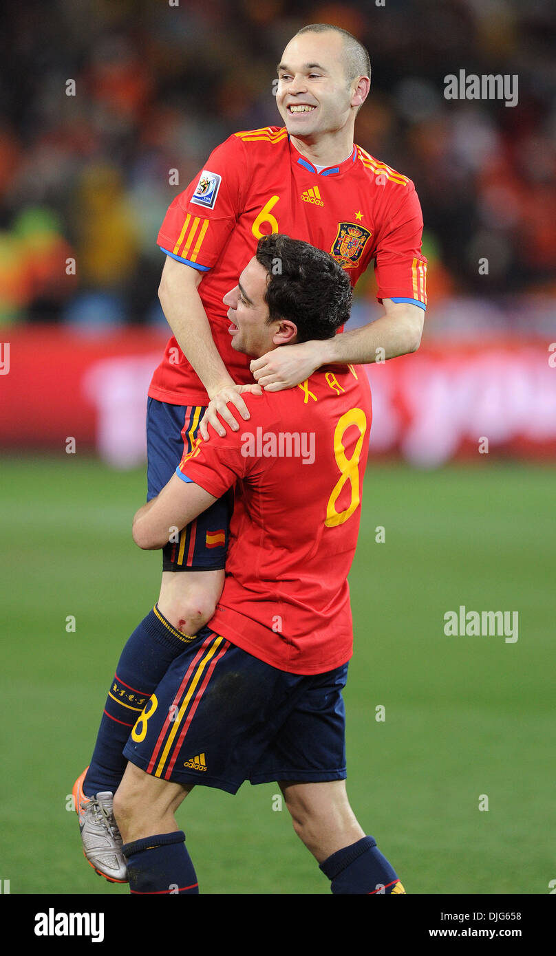 July 11, 2010 - Johannesburg, South Africa - Andres Iniesta of Spain celebrates with Xavi after the 2010 FIFA World Cup Final soccer match between Netherlands and Spain at Soccer City Stadium on July 11, 2010 in Johannesburg, South Africa. (Credit Image: © Luca Ghidoni/ZUMApress.com) Stock Photo