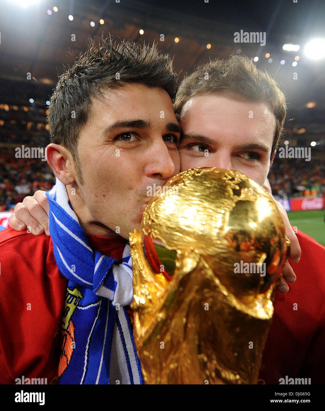 July 11, 2010 - Johannesburg, South Africa - David Villa and Juan Manuel Mata of Spain celebrate with the World Cup trophy after the 2010 FIFA World Cup Final soccer match between Netherlands and Spain at Soccer City Stadium on July 11, 2010 in Johannesburg, South Africa. (Credit Image: © Luca Ghidoni/ZUMApress.com) Stock Photo