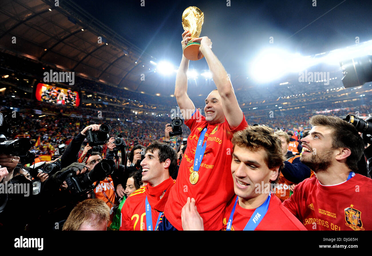July 11, 2010 - Johannesburg, South Africa - Andres Iniesta of Spain celebrates with the World Cup trophy after the 2010 FIFA World Cup Final soccer match between Netherlands and Spain at Soccer City Stadium on July 11, 2010 in Johannesburg, South Africa. (Credit Image: © Luca Ghidoni/ZUMApress.com) Stock Photo