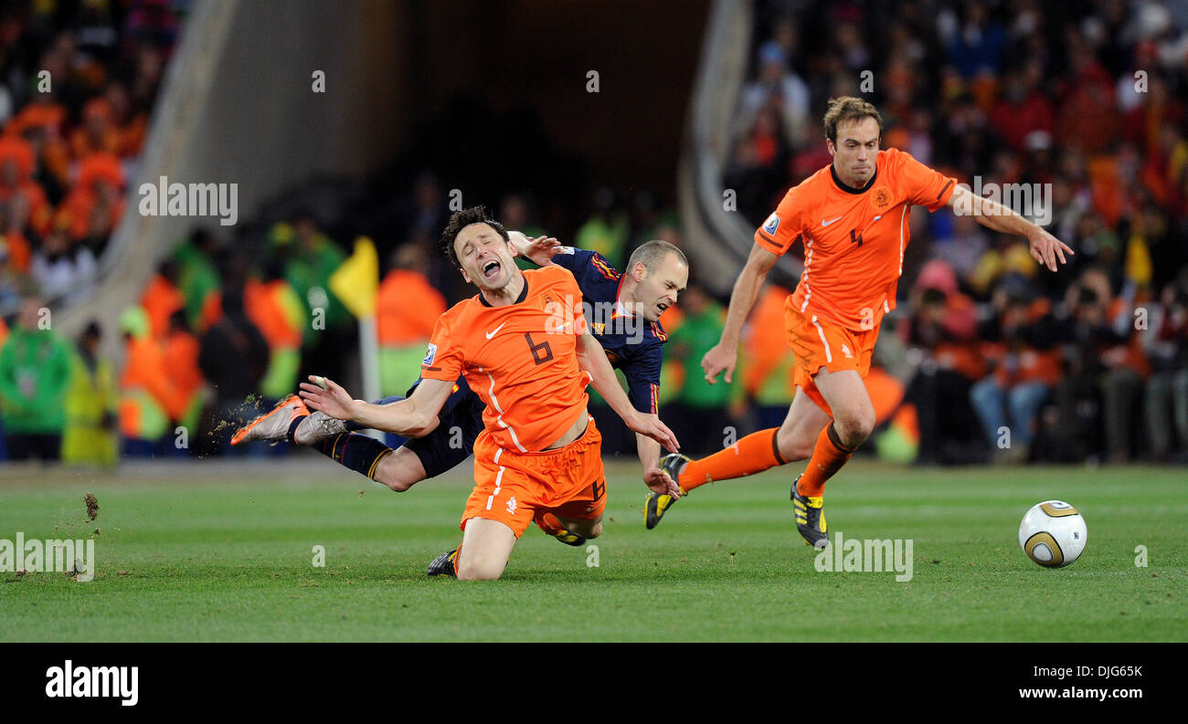 July 11, 2010 - Johannesburg, South Africa - Mark Van Bommel of Netherlands fights for the ball with Andres Iniesta of Spain during the 2010 FIFA World Cup Final soccer match between Netherlands and Spain at Soccer City Stadium on July 11, 2010 in Johannesburg, South Africa. (Credit Image: © Luca Ghidoni/ZUMApress.com) Stock Photo