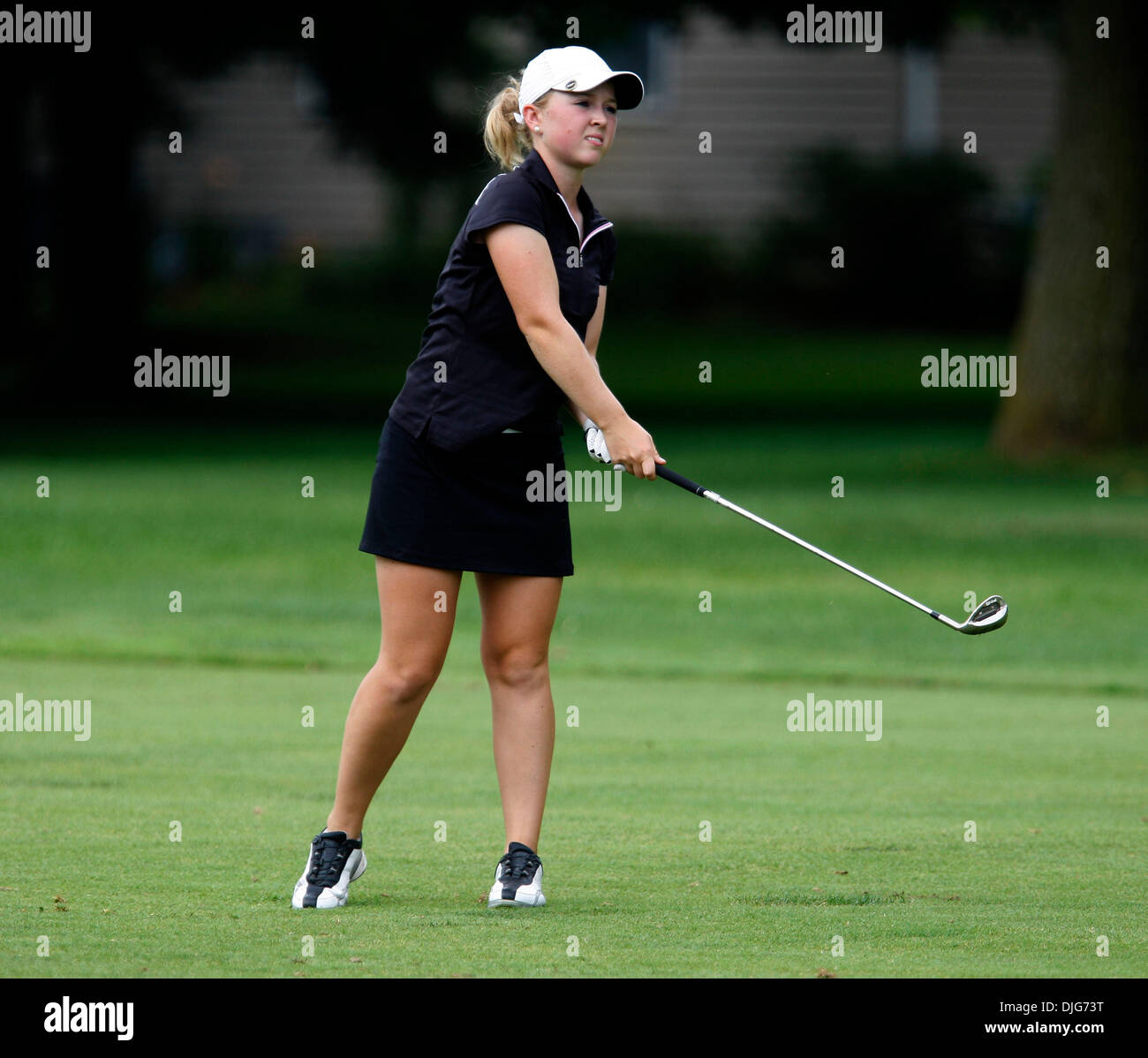 Jul 13, 2010 - Granger, Indiana, U.S. - MEGHAN MCDOUGALL, of Markham, Ontario, Canada, watches the flight of her approach shot on the back nine Tuesday during the Women's Western Golf Association 84th National Junior Championship at Knollwood Country Club. McDougall finished tied for 16th in the two day qualifying round with a score of 153 and advances to the championship flight of Stock Photo