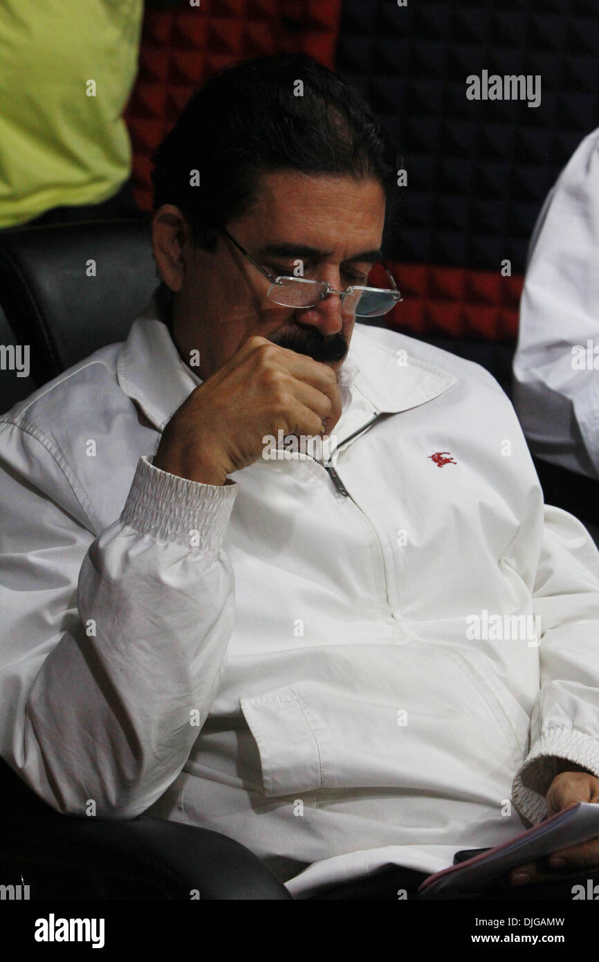 Tegucigalpa, Honduras. 27th Nov, 2013. Former Honduran President Manuel Zelaya attends a television program with his wife Xiomara Castro, presidential candidate of the Liberty and Refoundation Party (LIBRE), in Tegucigalpa, capital of Honduras, on Nov. 27, 2013. Head of Honduras' electoral tribunal David Matamoros declared on Wednesday that conservative Juan Orlando Hernandez had won more votes in the presidential poll. Credit: Rafael Ochoa/Xinhua/Alamy Live News Stock Photo