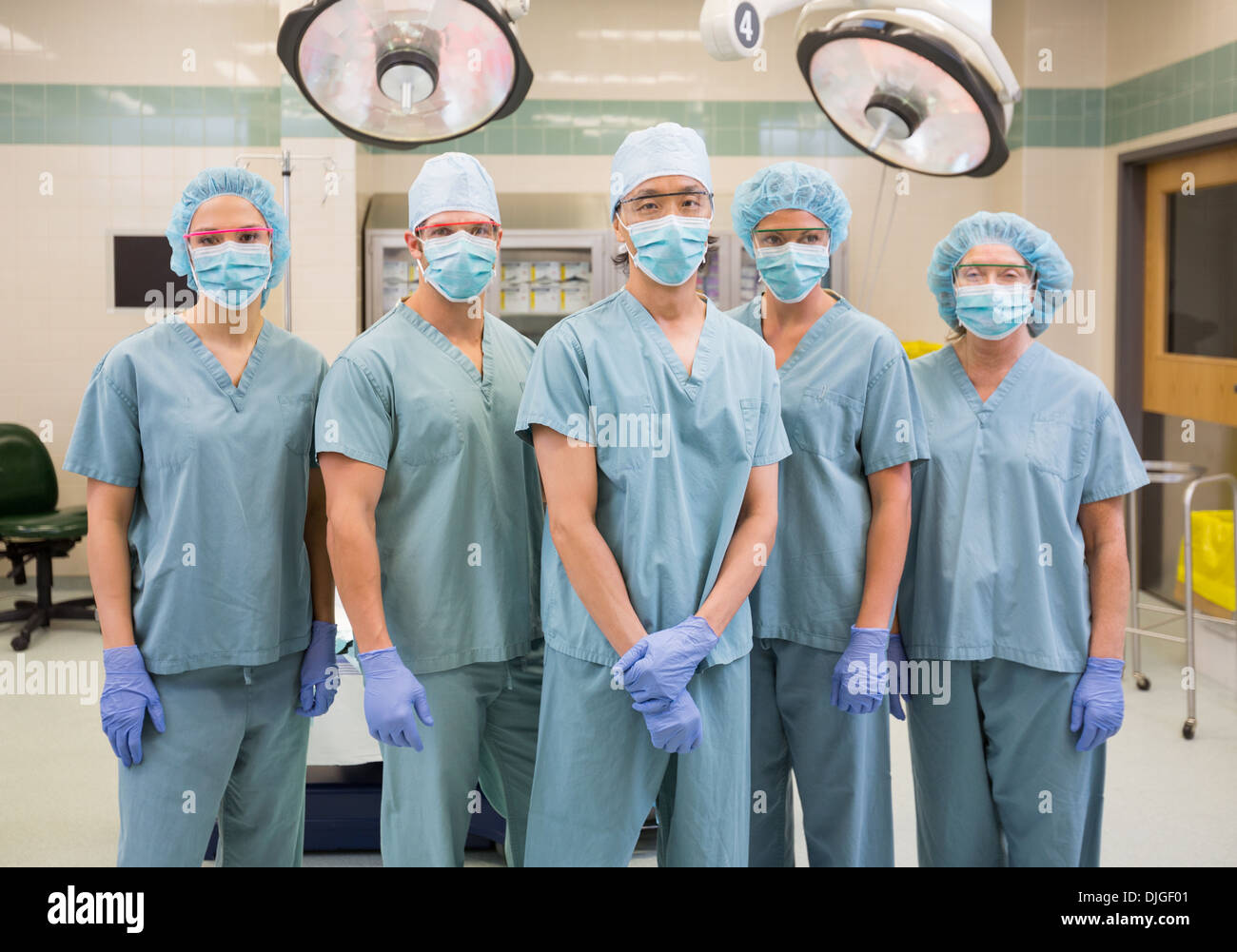 Confident Medical Team Standing In Operation Room Stock Photo - Alamy