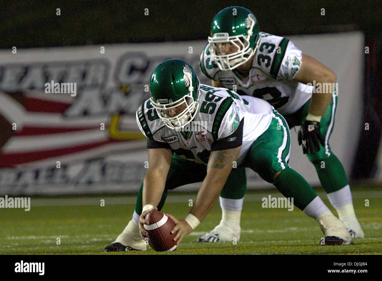 July 24, 2010 - Calgary, Alberta, Canada - 24 July 2010: Saskatchewan Roughriders long snapper Jocelyn Frenette (59) and running back Chris Szarka (33)during a game against the Calgary Stampeders at McMahon Stadium in Calgary, Alberta.  The Calgary Stampeders defeated the Saskatchewan Roughriders 40 to 20..Mandatory Credit: Irena Thompson / Southcreek Global (Credit Image: Â© South Stock Photo