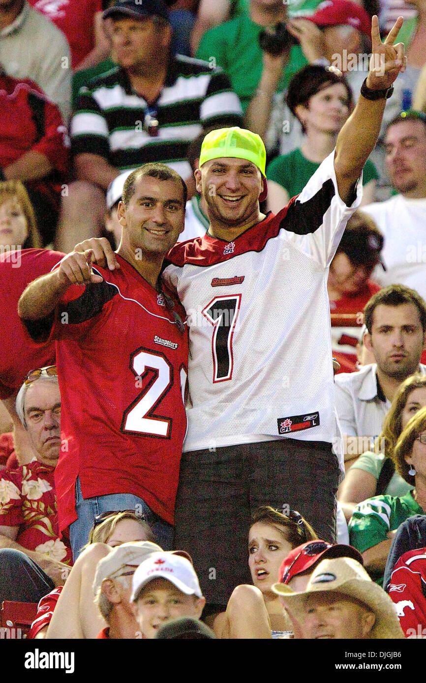 July 24, 2010 - Calgary, Alberta, Canada - 24 July 2010: A pair of Calgary Stampeders fans during a game against the Saskatchewan Roughriders at McMahon Stadium in Calgary, Alberta.  The Calgary Stampeders defeated the Saskatchewan Roughriders 40 to 20..Mandatory Credit: Irena Thompson / Southcreek Global (Credit Image: Â© Southcreek Global/ZUMApress.com) Stock Photo