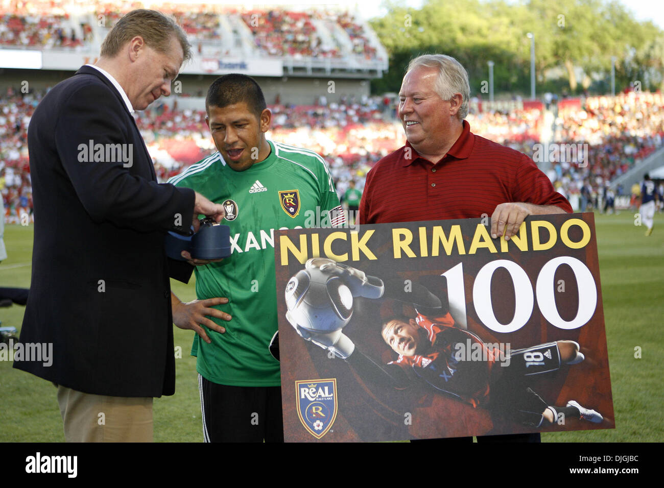 July 24, 2010 - Sandy, Utah, United States of America - 24 July 2010: Real Salt Lake goalkeeper Nick Rimando receives an honorary watch from Real Salt Lake owner David W. Checketts  moments before the game Rio Tinto Stadium for his 100th win...Mandatory Credit: Stephen Holt / Southcreek Global (Credit Image: © Southcreek Global/ZUMApress.com) Stock Photo