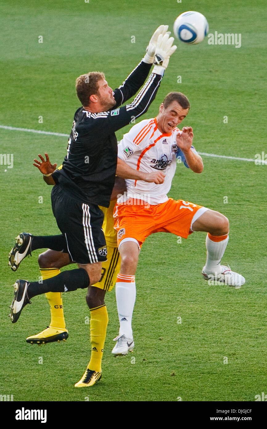July 24, 2010 - Columbus, Ohio, United States of America - 24 July 2010:  Crew goalkeeper William Hesmer (1) leaps over Dynamo forward Cam Weaver (15) and Crew defender Shaun Francis (29) to save a Dynamo shot on goal during first-half match action.  The Columbus Crew defeated the Houston Dynamo 3-0 at Crew Stadium in Columbus, Ohio.   .Mandatory Credit: Scott W. Grau / Southcreek  Stock Photo