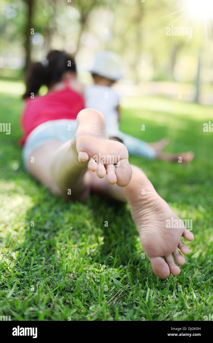 Mother daughter lie on grass hi-res stock photography and images - Alamy