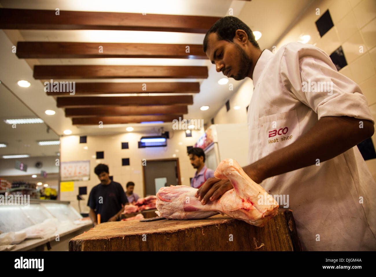 Asian butcher chopping raw meat on a cutting board Stock Photo - Alamy