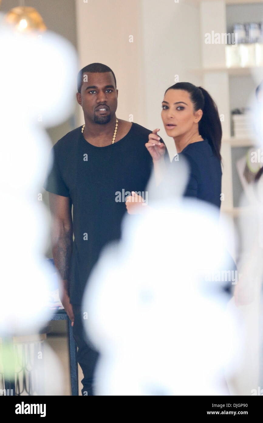 Kim Kardashian and boyfriend Kanye West attend the grand opening for