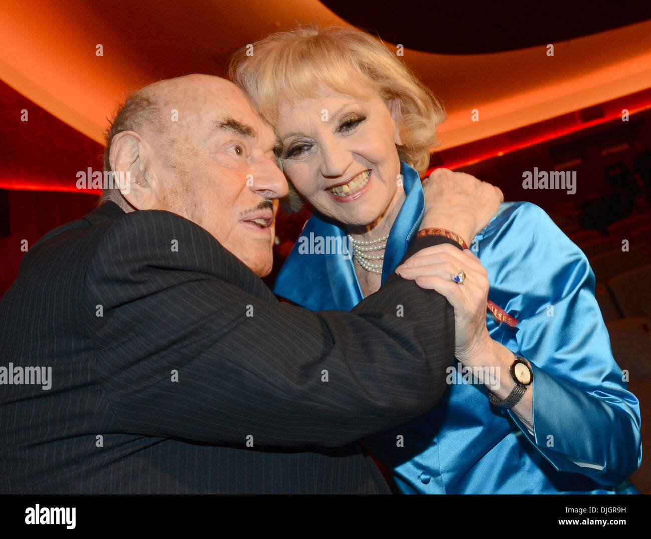 Berlin, Germany. 27th Nov, 2013. Movie producer Atze Brauner and actress Liselotte Pulver hug in the reopened cinema 'Zoo Palast' in Berlin, Germany, 27 November 2013. Photo: Britta Pedersen/dpa/Alamy Live News Stock Photo