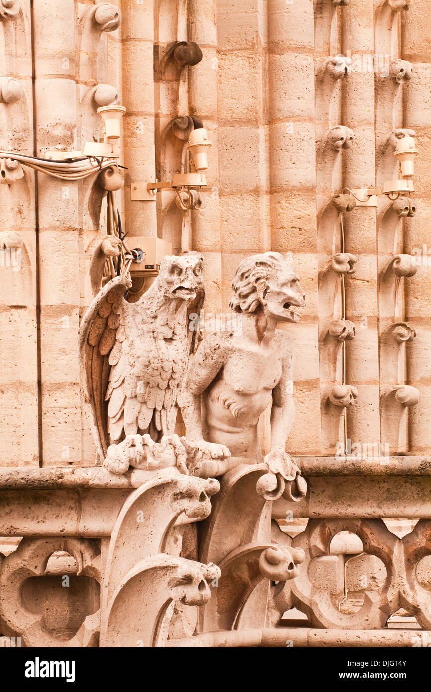 Two of the famous gargoyles adorning Notre Dame de Paris cathedral
