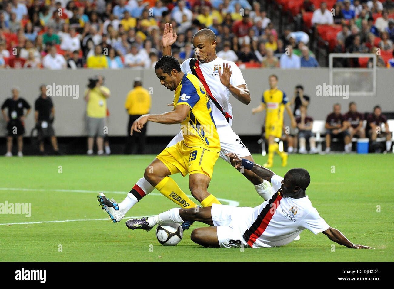 July 27, 2010 - Atlanta, Georgia, United States of America - 28 July 2010:  Miguel Layun (19) of Club America, Manchester City defender Vincent Kompany (33) and Manchester City midfielder Shaun Wright-Phillips (8) Scramble for the ball at the Georgia Dome in Atlanta, Georgia.  Final Score;  .Mandatory Credit: Marty Bingham / Southcreek Global (Credit Image: © Southcreek Global/ZUMA Stock Photo