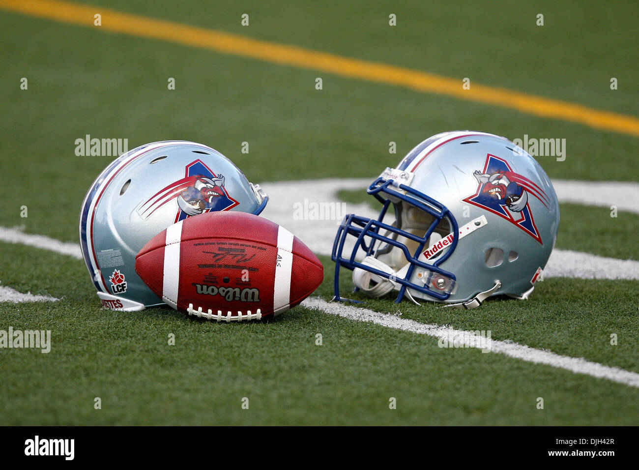 July 29, 2010 - Montreal, Quebec, Canada - 29 July 2010: Helmets on the  field in warm-up prior to the CFL game between the Toronto Argonauts and  the Montreal Alouettes played at