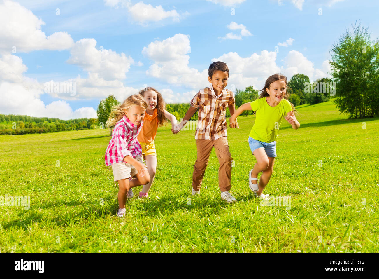 group-of-little-6-and-7-years-old-kids-boys-and-girls-running-holding