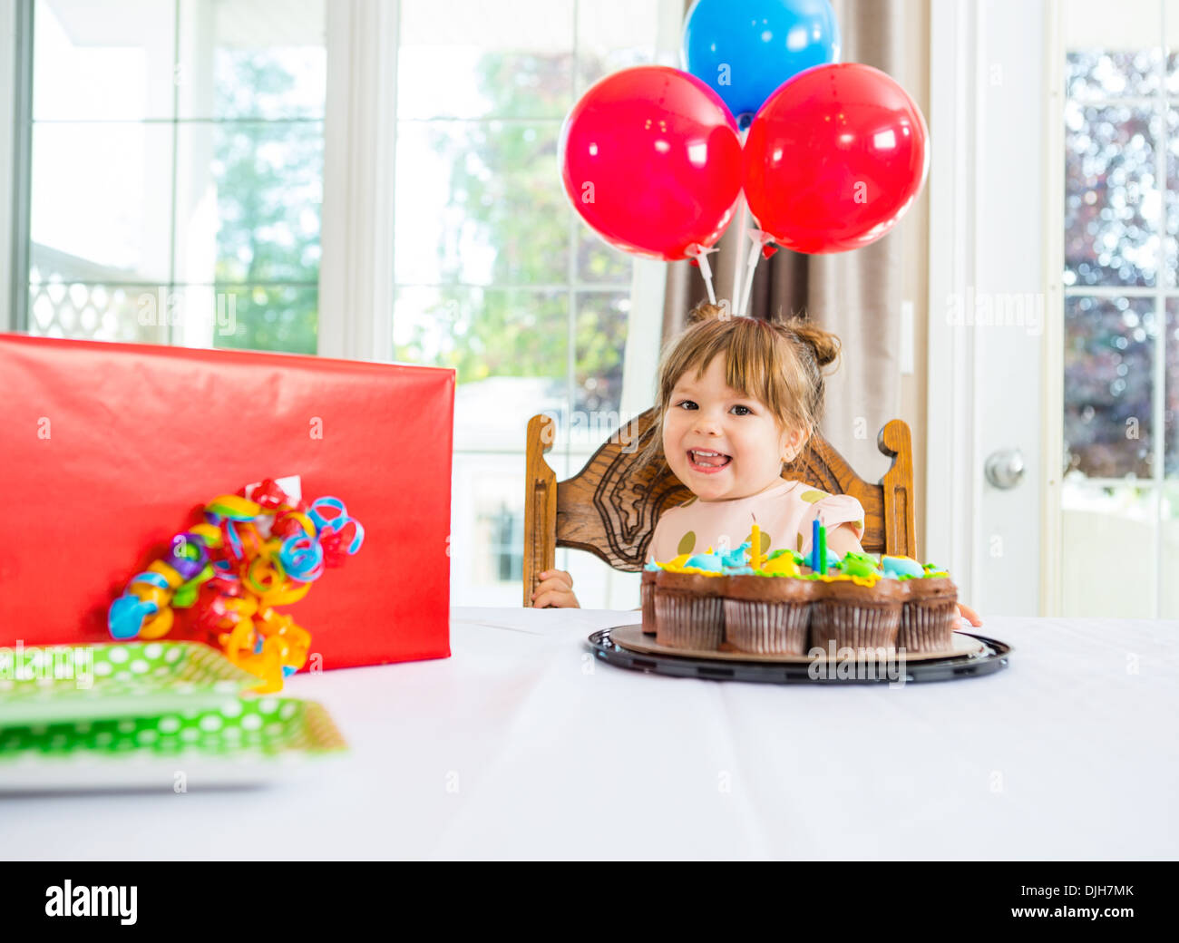 Birthday Girl With Cake And Present On Table Stock Photo Alamy