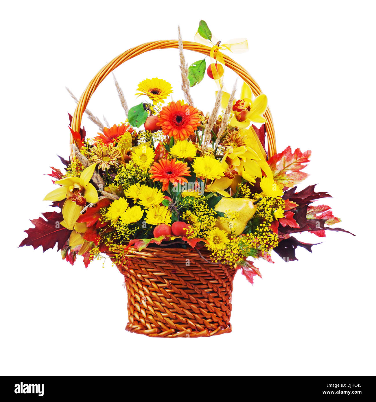 Colorful flower bouquet arrangement centerpiece in wicker basket isolated on white background. Closeup. Stock Photo