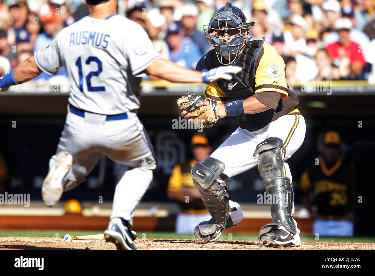 Dodgers Brad Ausmus was tagged out at home by Padres catcher Yorvit