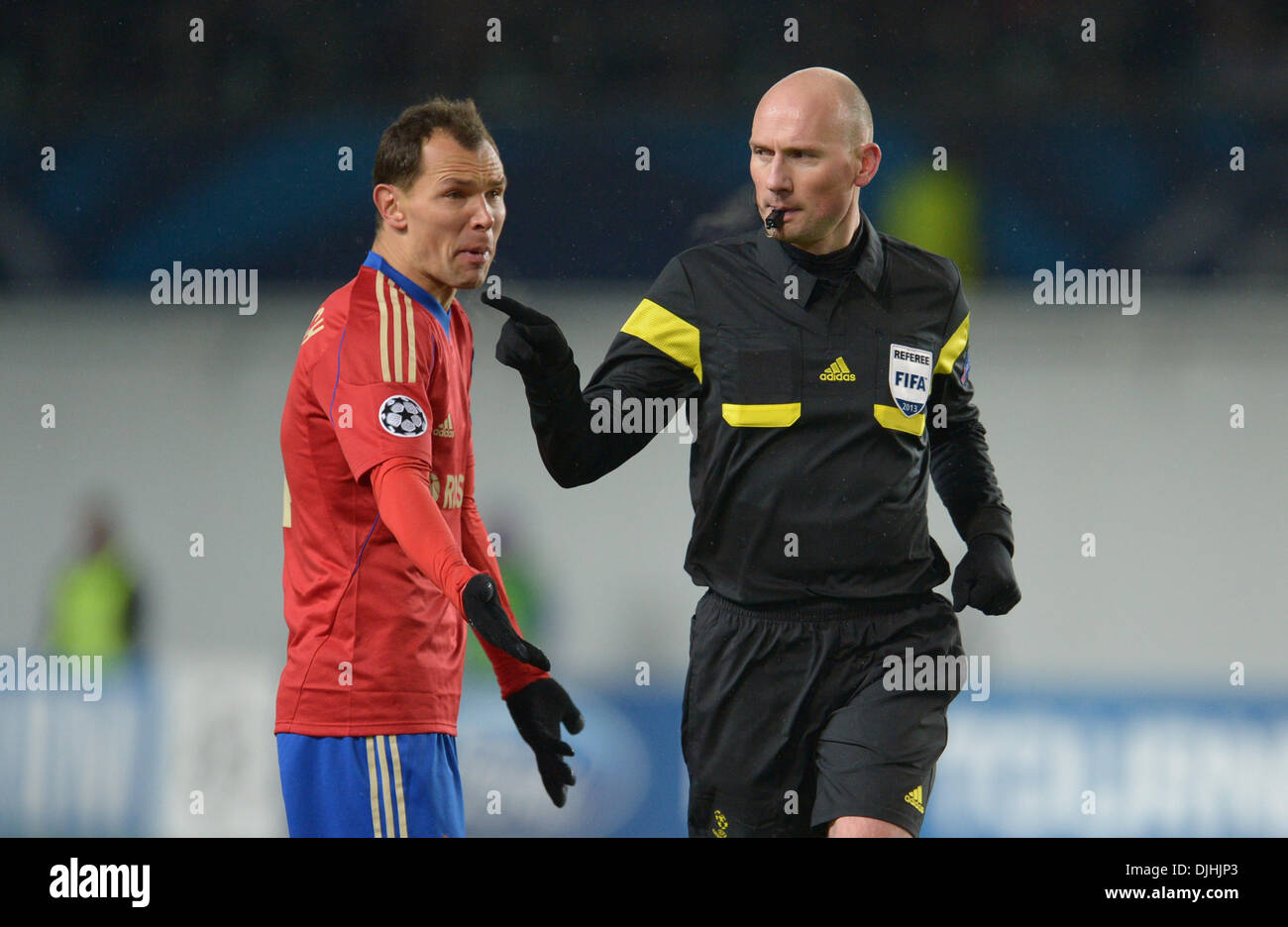 Moscow, Russia. 27th Nov, 2013. Referee Antony Gautier (L) talks to Moscow's Sergei Ignashevich during the UEFA Champions League Group D soccer match between CSKA Moscow and FC Bayern Munich at Arena Chimki in Moscow, Russia, 27 November 2013. Photo: Andreas Gebert/dpa/Alamy Live News Stock Photo