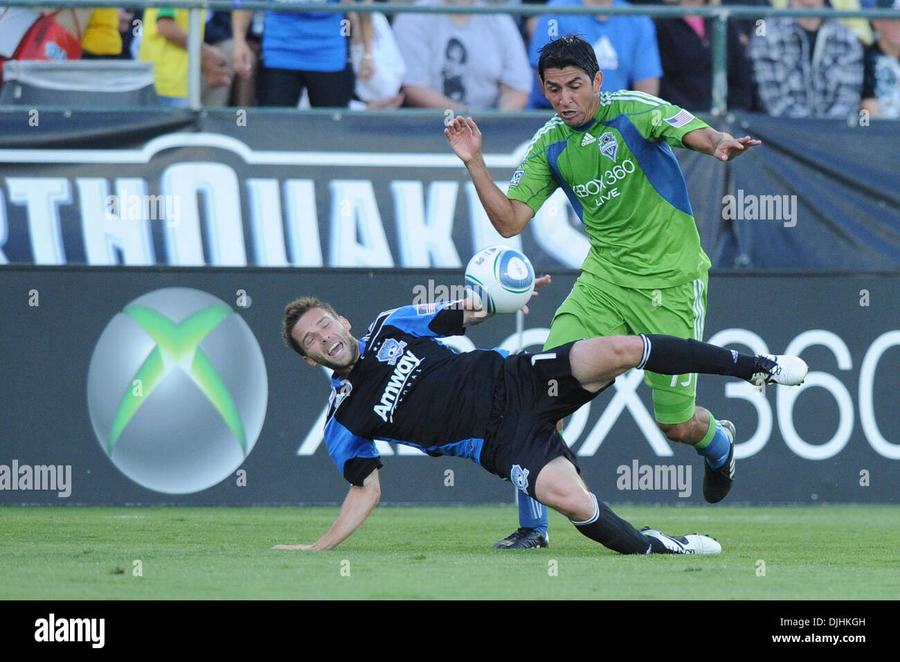 July 31, 2010 - Santa Clara, California, United States of America - 31 July 2010: Seattle Sounders D Leonardo Gonzalez (19) brings down San Jose Earthquakes M Bobby Convey (11)  during the MLS match between the San Jose Earthquakes and Seattle Sounders at Buck Shaw Stadium in Santa Clara, CA.  The visiting Sounders won 1-0 and picked up the second annual Heritage Cup..Mandatory Cre Stock Photo