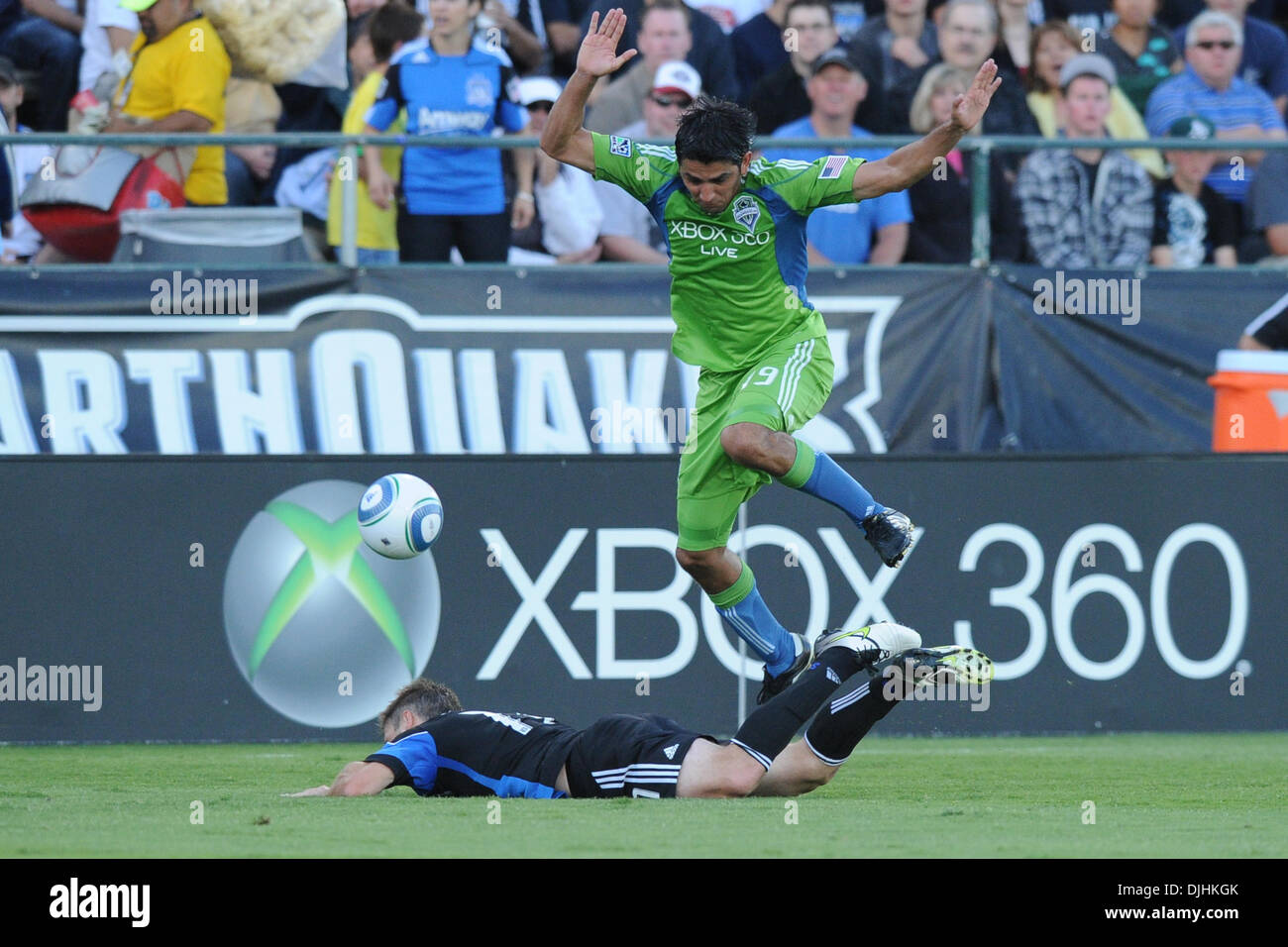 July 31, 2010 - Santa Clara, California, United States of America - 31 July 2010: Seattle Sounders D Leonardo Gonzalez (19) brings down San Jose Earthquakes M Bobby Convey (11)  during the MLS match between the San Jose Earthquakes and Seattle Sounders at Buck Shaw Stadium in Santa Clara, CA.  The visiting Sounders won 1-0 and picked up the second annual Heritage Cup..Mandatory Cre Stock Photo