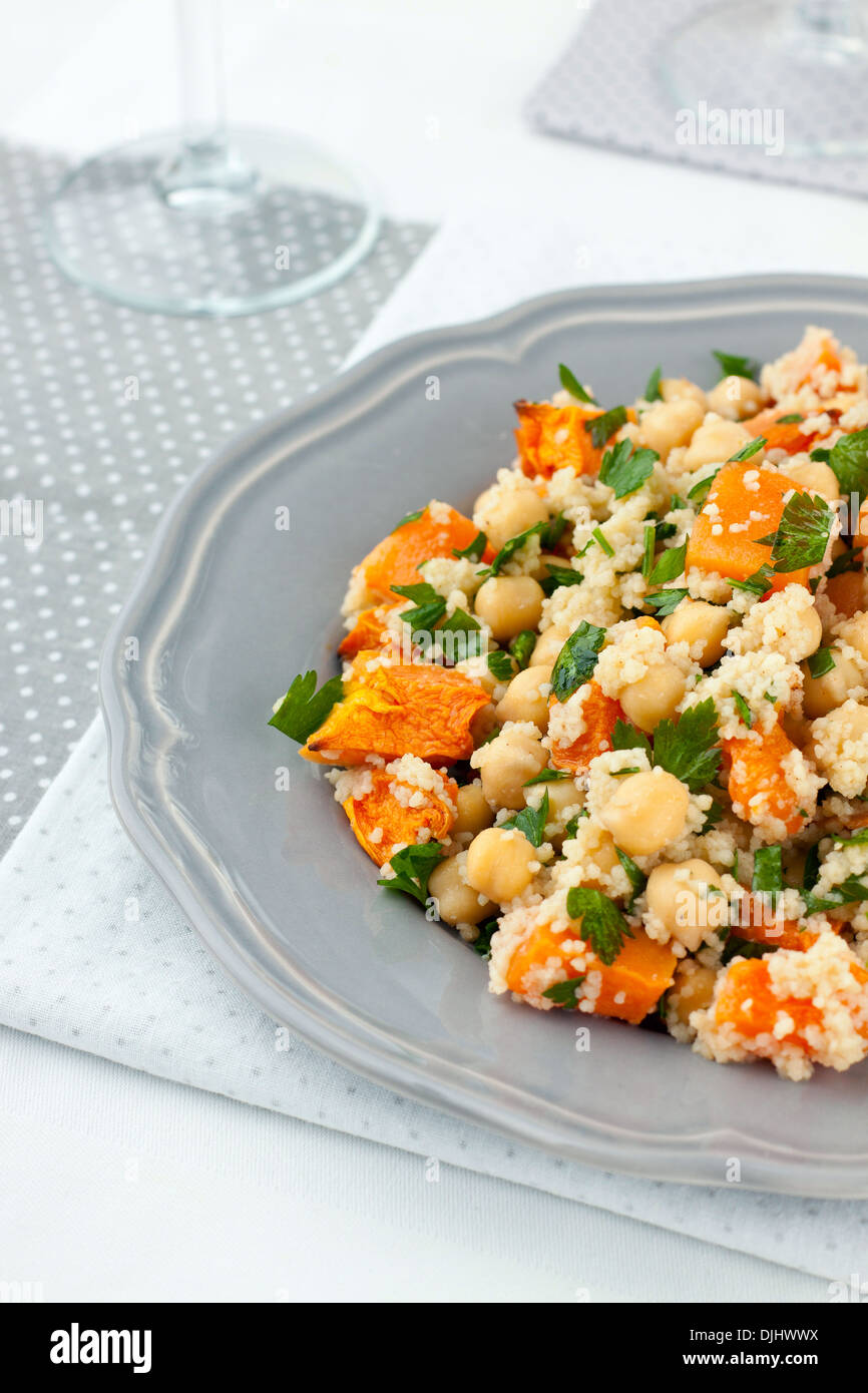 Plate of pumpkin salad with chickpeas and couscous Stock Photo