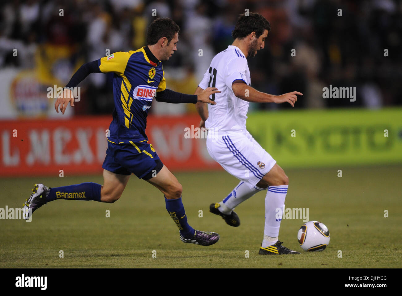 Aug. 04, 2010 - San Francisco, California, U.S - August 4, 2010: Club America M Miguel Layun (19) shadows Real Madrid F Gonzalo Higuain (20) during the friendly between Real Madrid and Club America at Candlestick Park in San Francisco, CA.  Real Madrid took the contest 3-2. (Credit Image: © Matt Cohen/Southcreek Global/ZUMApress.com) Stock Photo