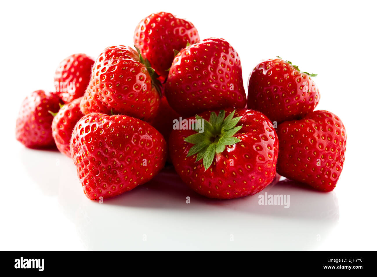 ripe strawberry isolated on white reflexive background Stock Photo - Alamy