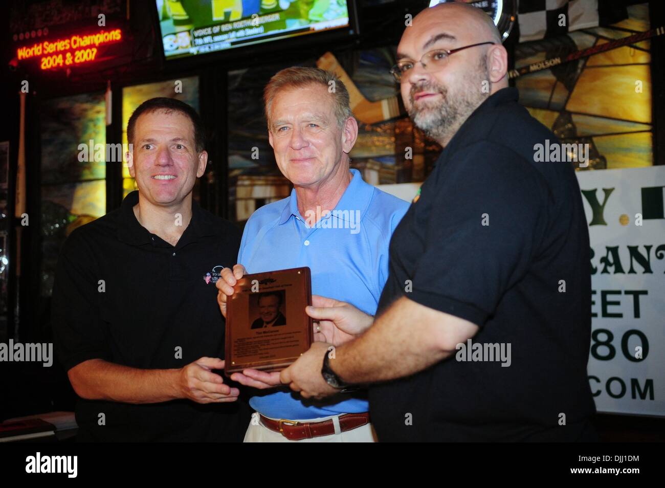 Aug. 06, 2010 - Manhattan, New York, U.S. - Inductee TIM MCCARVER (C) with curator John Mooney (L) and owner of Foley's Shaun Clancey (R) at the ceremony as Irish Americans are inducted into the Irish American Baseball Hall of Fame at Foley's NY Pub & Restaurant on West 33rd Street. (Credit Image: Â© Bryan Smith/ZUMApress.com) Stock Photo