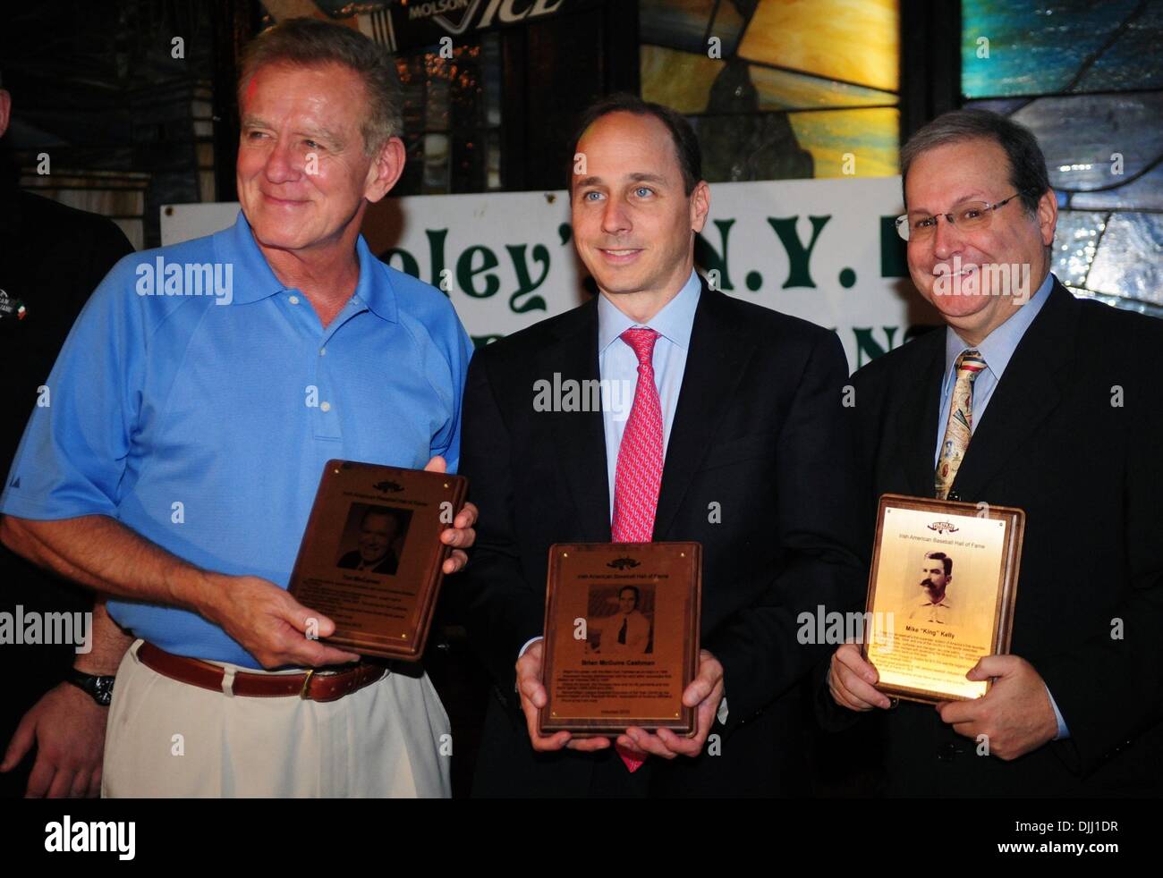 Aug. 06, 2010 - Manhattan, New York, U.S. - Inductees TIM MCCARVER (L), NY Yankees GM BRIAN CASHMAN (C) and baseball historian MARTY APPEL (R) representing Mike ''King'' Kelly at the ceremony as Irish Americans are inducted into the Irish American Baseball Hall of Fame at Foley's NY Pub & Restaurant on West 33rd Street. (Credit Image: Â© Bryan Smith/ZUMApress.com) Stock Photo