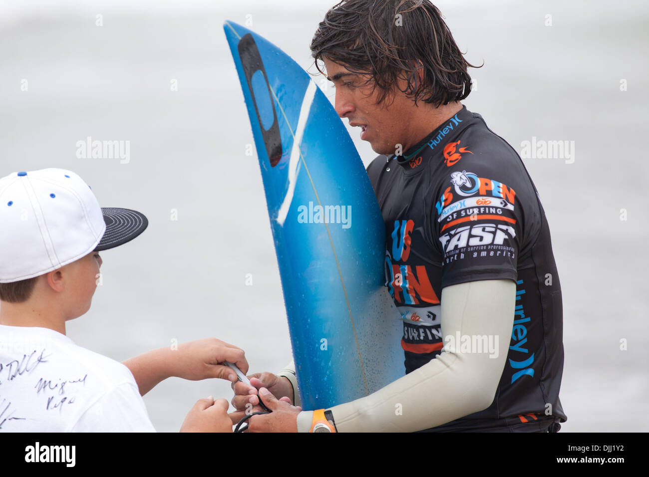 Aug. 06, 2010 - Huntington Beach, California, United States of America - 6 August 2010: Brazillian Miguel Pupo signs autographs for fans after his heat in Round 4 of Mens Surfing competetion at the US Open of Surfing in Huntington Beach, California.  Pupo won his heat and advances on to Round 5.  Mandatory Credit: Josh Chapel / Southcreek Global (Credit Image: © Southcreek Global/Z Stock Photo