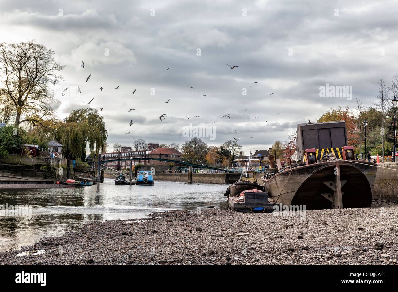 Boats stranded River Thames at low tide during the annual draw off