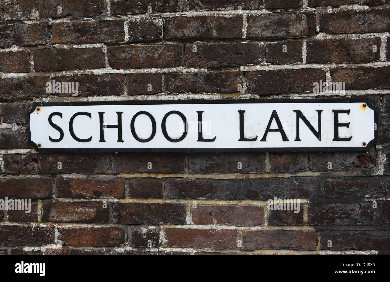 School Lane sign on a brick wall in Arundel England UK Stock Photo Alamy