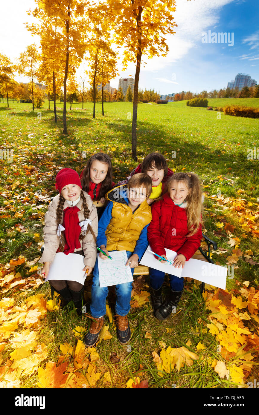 Group Of Smiling Happy Kids Friends Boys And Girls Sitting On The Bench In The Park Under The Autumn Maple Trees And Drawing Images Top View Stock Photo Alamy Group Of Smiling Happy Kids Friends Boys And Girls Sitting On The Bench In The Park Under The Autumn Maple Trees And Drawing Images Top View Stock Photo Alamy
