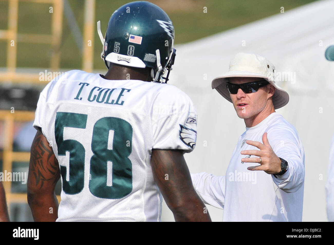 Aug. 10, 2010 - Bethlehem, Pennsylvania, United States of America - 10 August 2010 Philadelphia Eagles defensive lineman Trent Cole #58 is coached up by defensive coordinator Sean McDermott in a practice being held at Lehigh College in Bethlehem, Pennsylvania.Mandatory Credit: Michael McAtee / Southcreek Global (Credit Image: © Southcreek Global/ZUMApress.com) Stock Photo