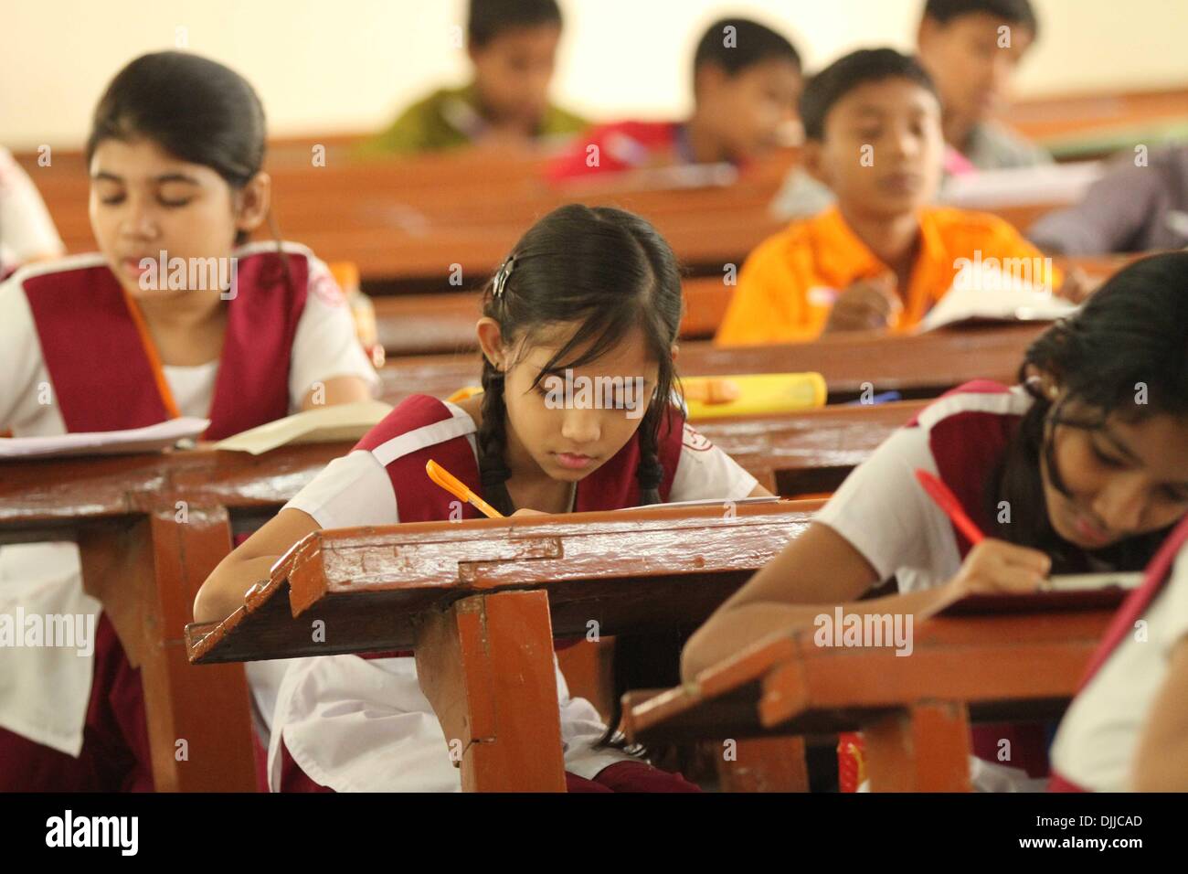 Dhaka 20 November 2013. Bangladeshi students sit for primary terminal examinations in Dhaka. Stock Photo