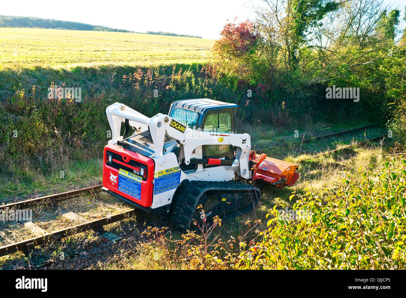 Caterpillar track Locami T870 machine clearing railway lines - France. Stock Photo
