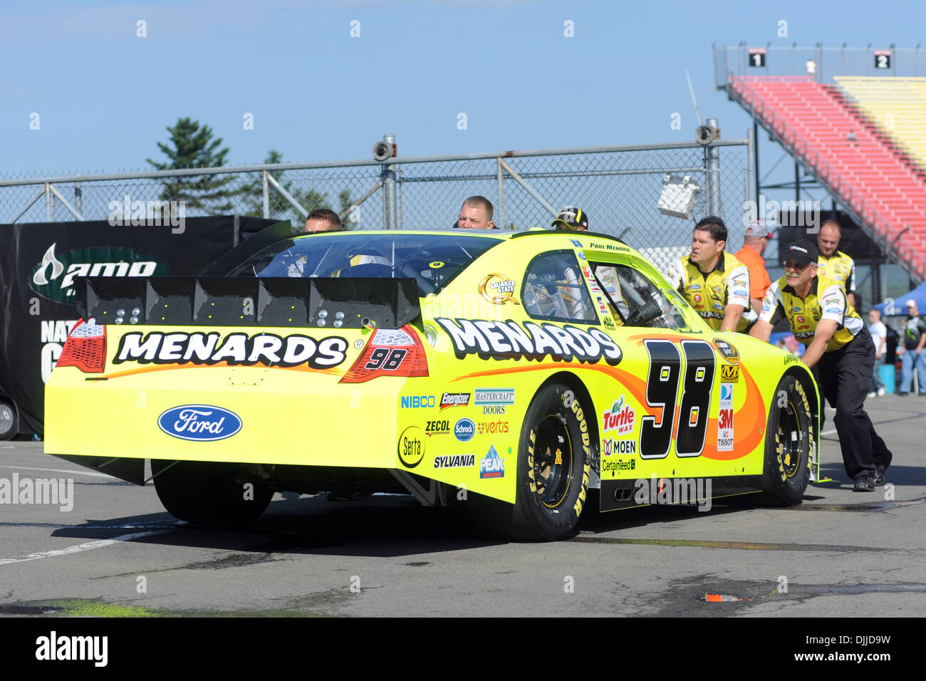 The crew of the #98 Menards Ford of driver PAUL MENARD pushes the car ...