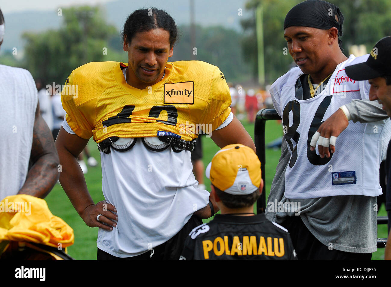 Aug. 11, 2010 - Latrobe, PENNSYLVANNIA, United States of America - 11 August, 2010: Pittsburgh Steelers' strong safety TROY POLAMALU (43) and Pittsburgh Steelers' wide receiver HINES WARD (86) talk with a young Steelers fan during training camp at St. Vincent College in Latrobe, PA...MANDATORY CREDIT: DEAN BEATTIE / SOUTHCREEK GLOBAL (Credit Image: © Southcreek Global/ZUMApress.com Stock Photo